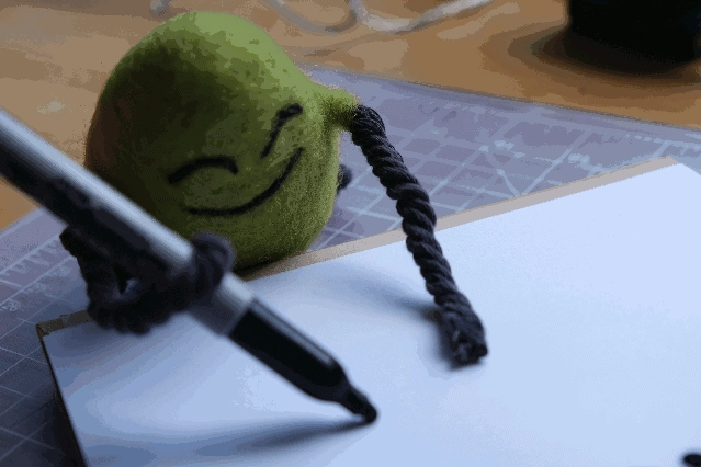 A stop-motion animation of Cloudia writing CBX.